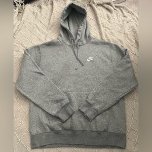 Nike sportswear Medium grey pullover hoodie with front pockets.